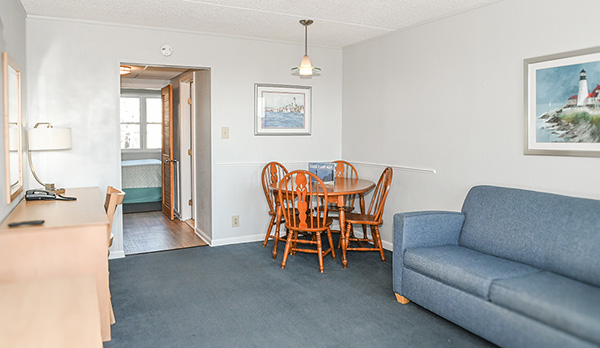 Queen sofa bed and dining table in a living room